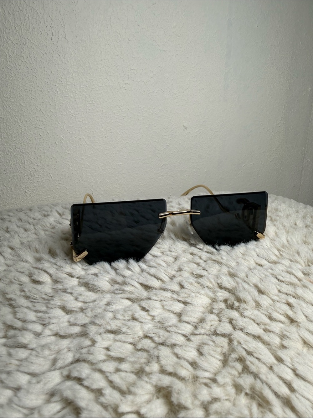 Stylish Rimless Black Sunglasses with Gold Accents - Women Accessories